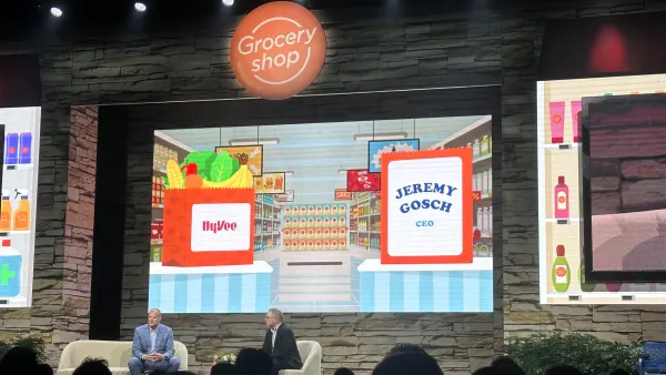 Keynote address at Groceryshop with two men on stage
