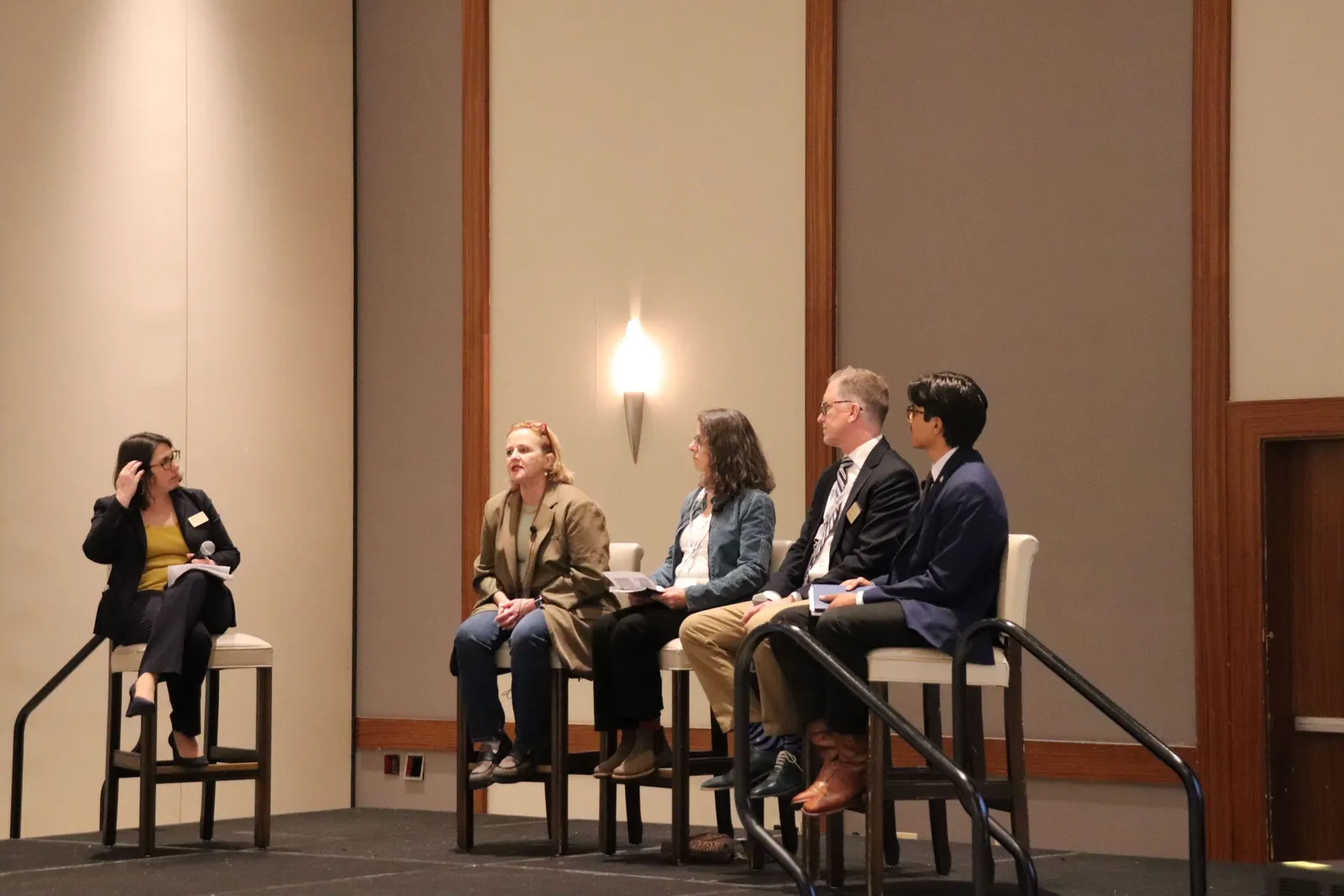 Five speakers sit on stage at the 2025 U.S. Product Stewardship Forum