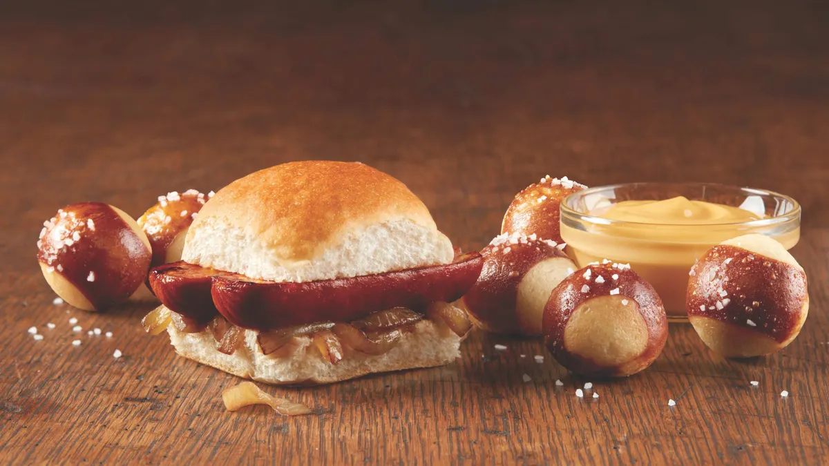 An image of a sausage slider and pretzel bites from White Castle