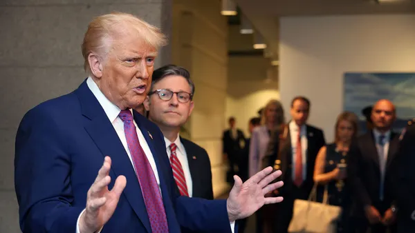 President Donald Trump speaks to reporters with Speaker of the House Mike Johnson.