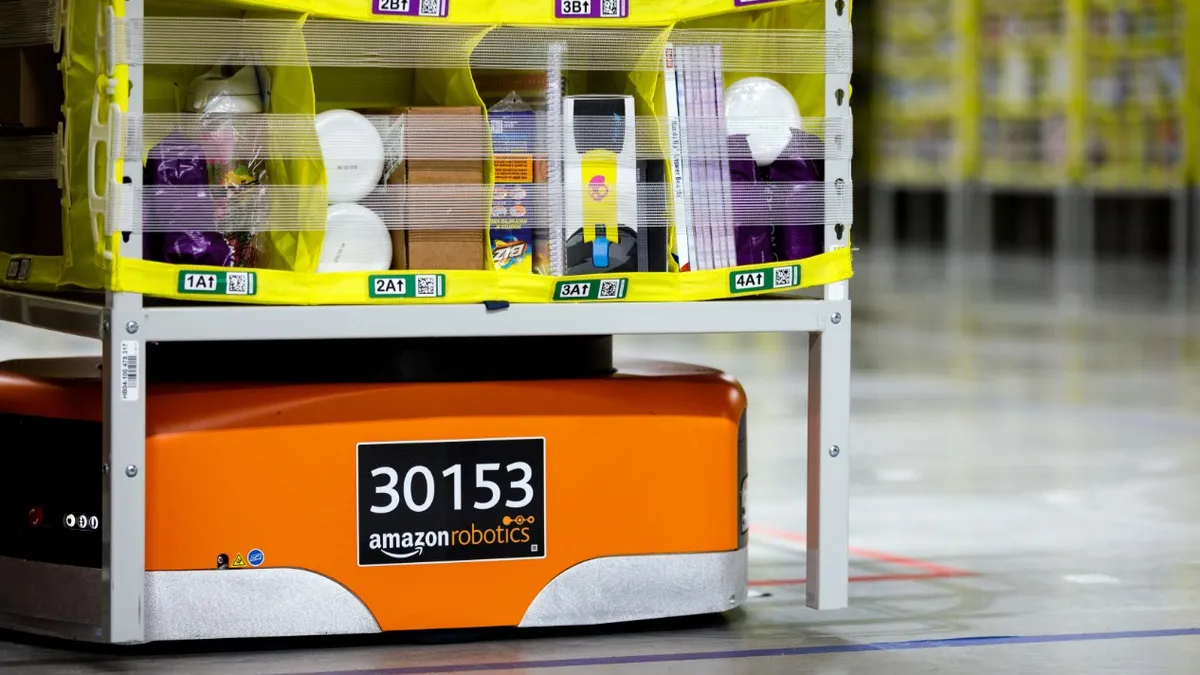 An Amazon robotics drive unit carries items.