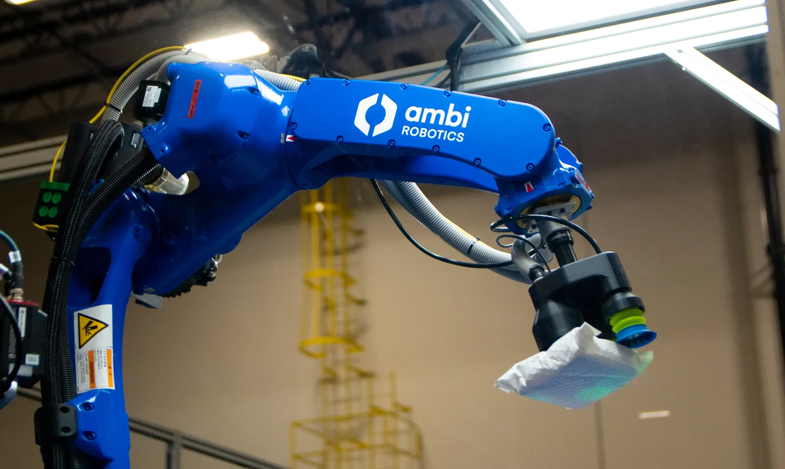 The automated AmbiSort system handles a parcel in a Pitney Bowes e-commerce hub in Bloomington, California.