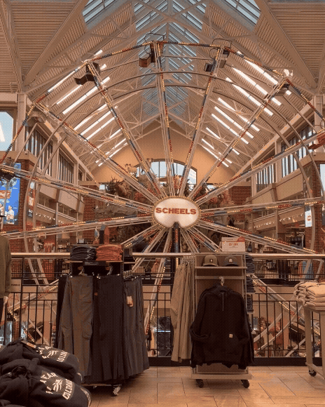 A ferris wheel spins at a Scheels store.