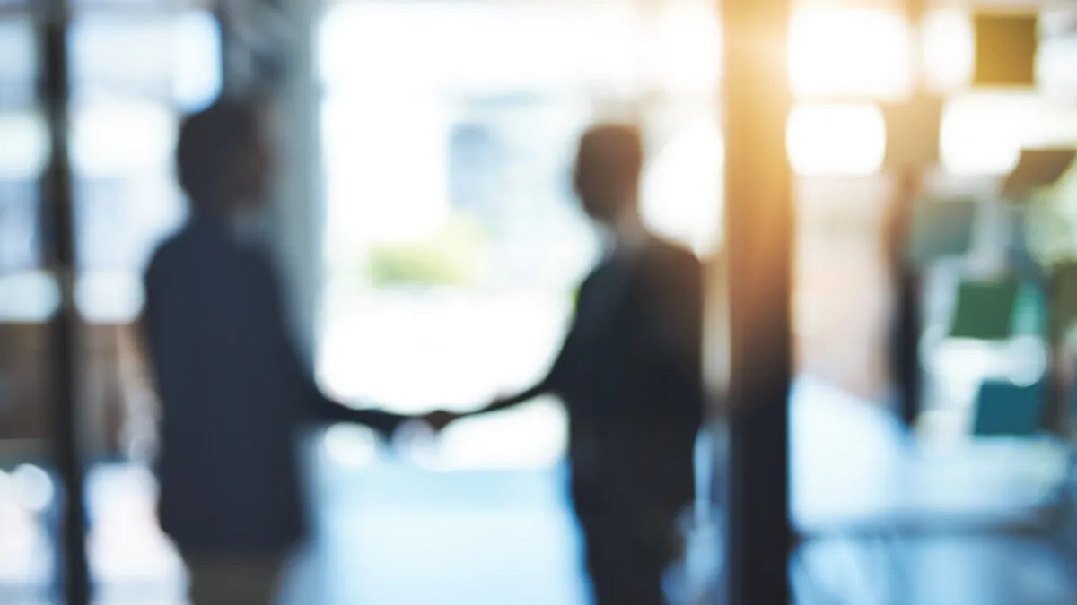 two people shaking hands