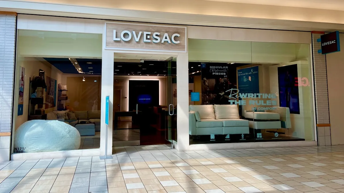 A mall entrance to a store named "Lovesac."