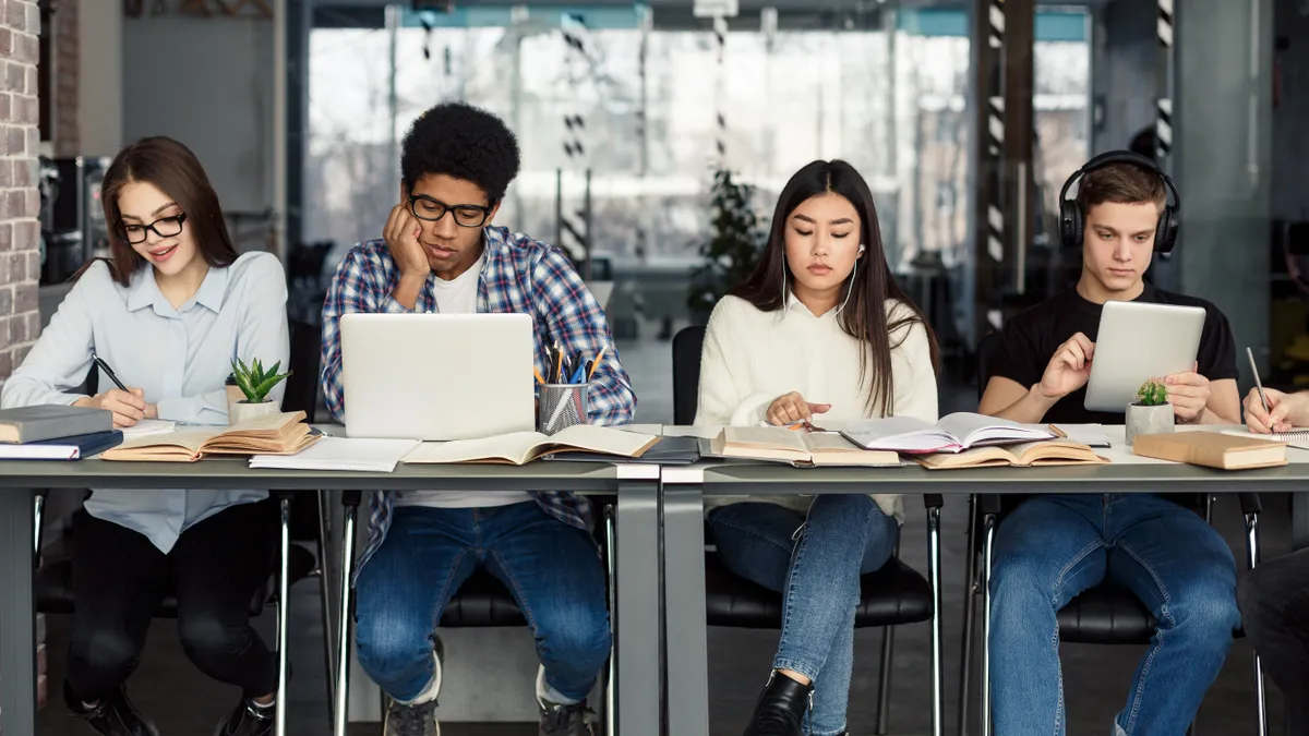 Students studying in a library.