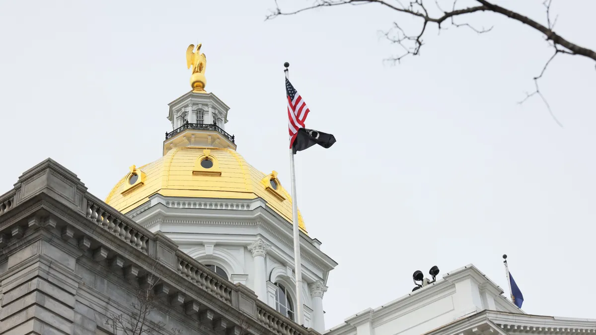 Capitol building dome with U.S. flag