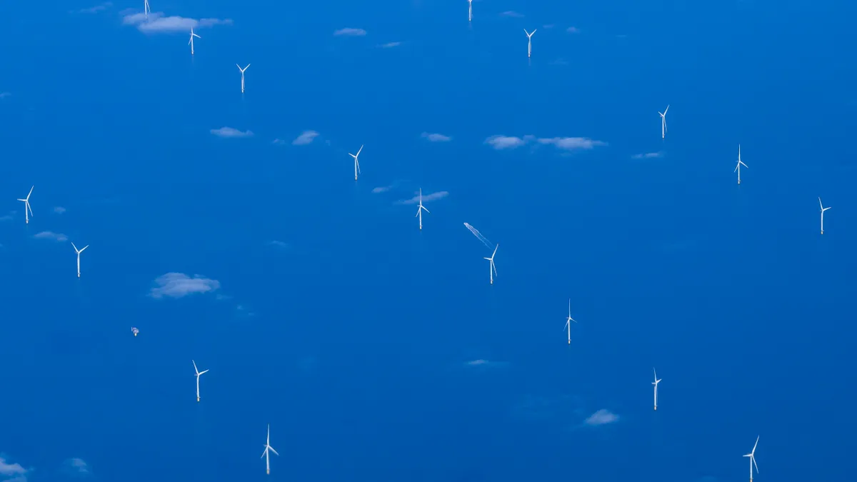 Offshore wind turbines in the ocean.