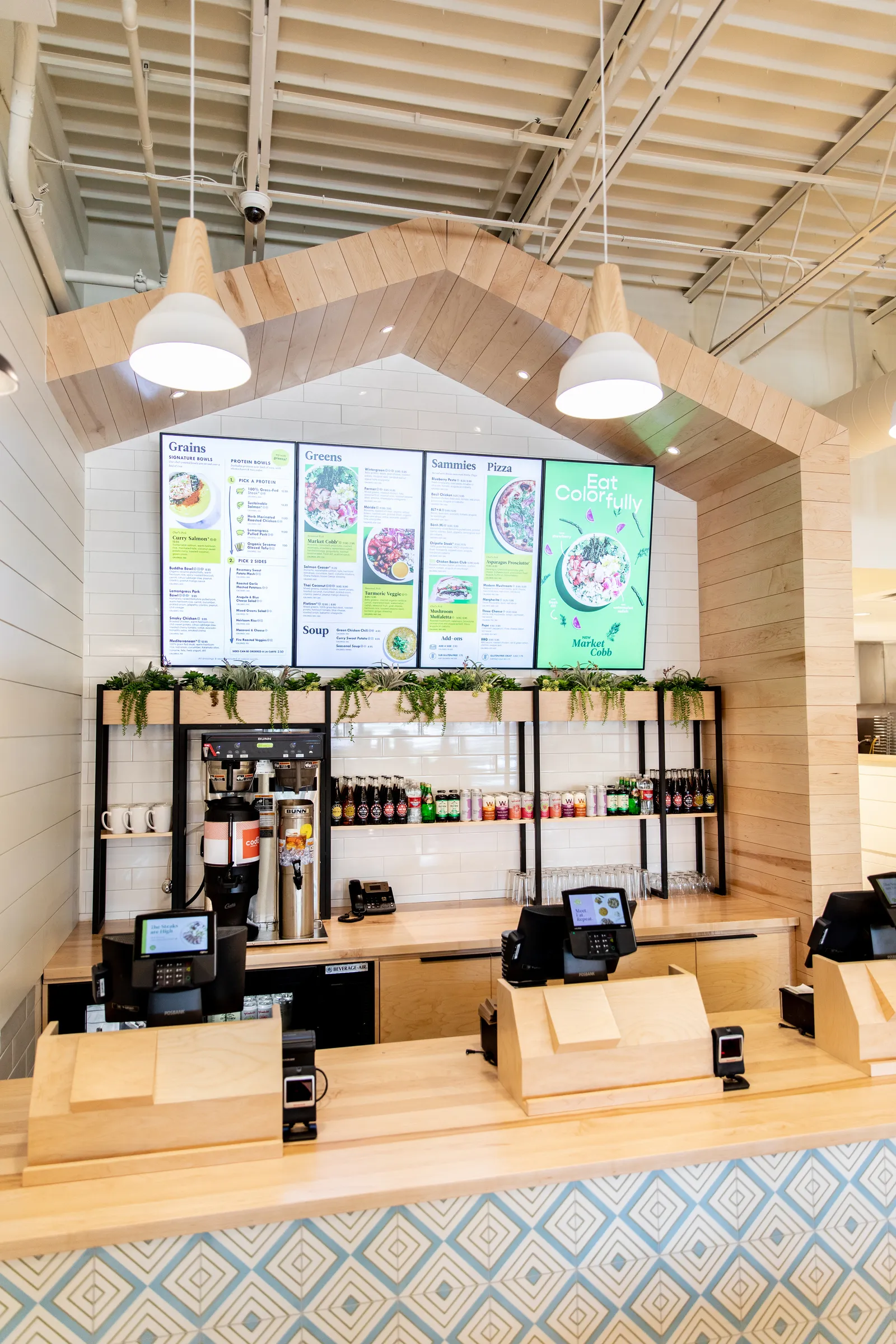 An image of a digital menu board inside Modern Market Eatery.