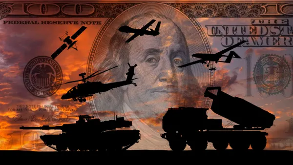 Silhouettes of military vehicles and fighter aircraft at dusk with a $100 bill and Benjamin Franklin's portrait in the background.