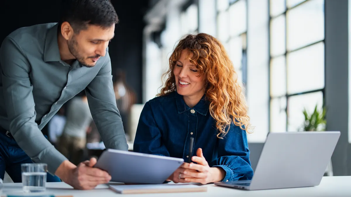 Colleagues discussing and sharing insights during a teamwork session