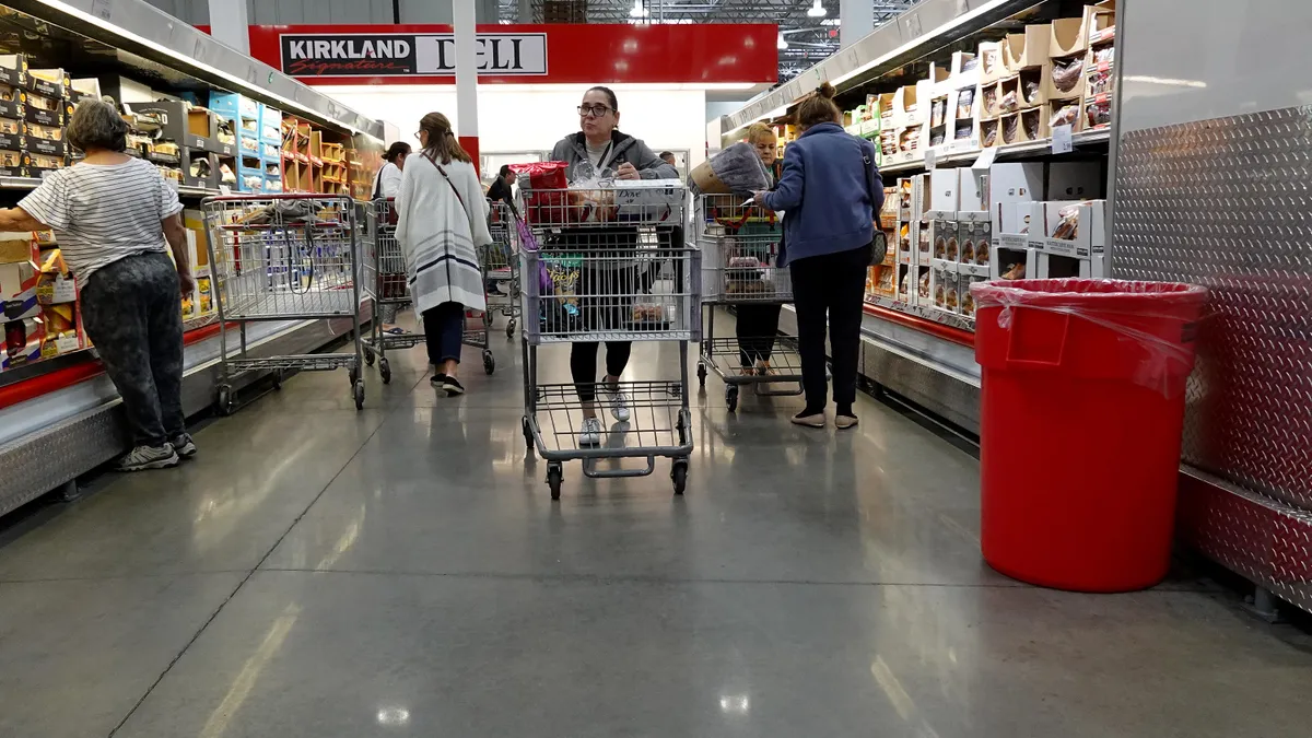 Person shopping inside a Costco store.