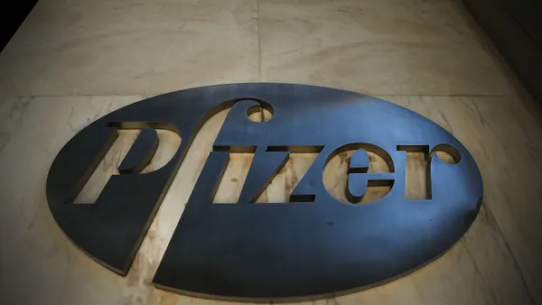 A view of Pfizer's steel logo from below.