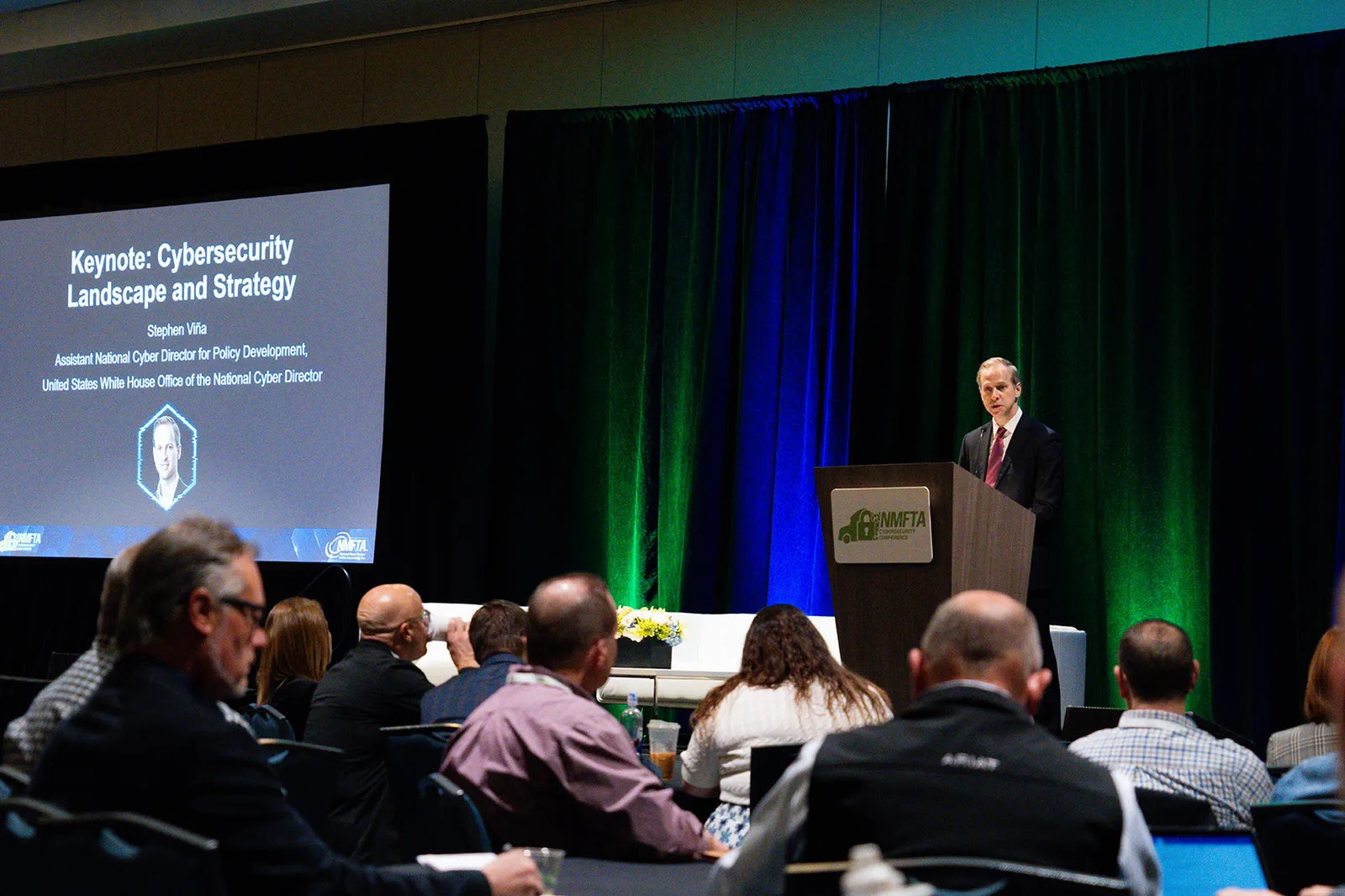 Attendees listen to a keynote speech from White House official Stephen Vina, who talked at the NMFTA&#x27;s Cybersecurity Conference.