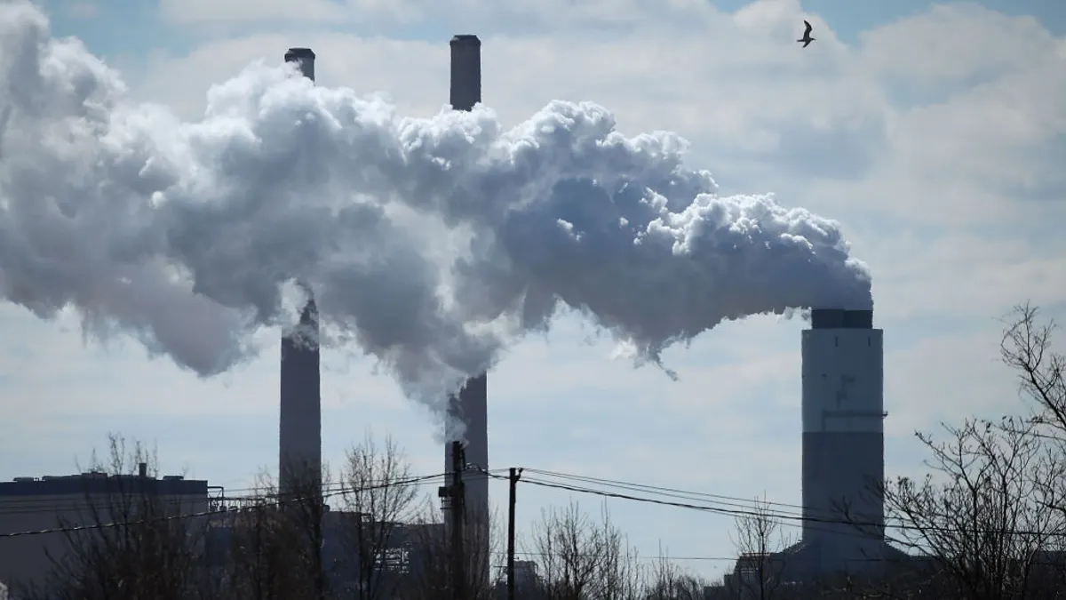 Smoke seen coming out of a power plant.