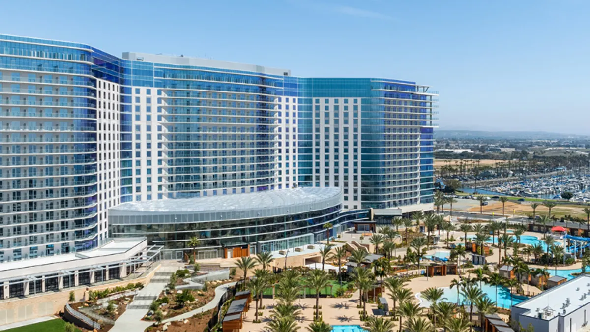 A shot of the Gaylord Pacific's exterior, flanked by a pool complex.