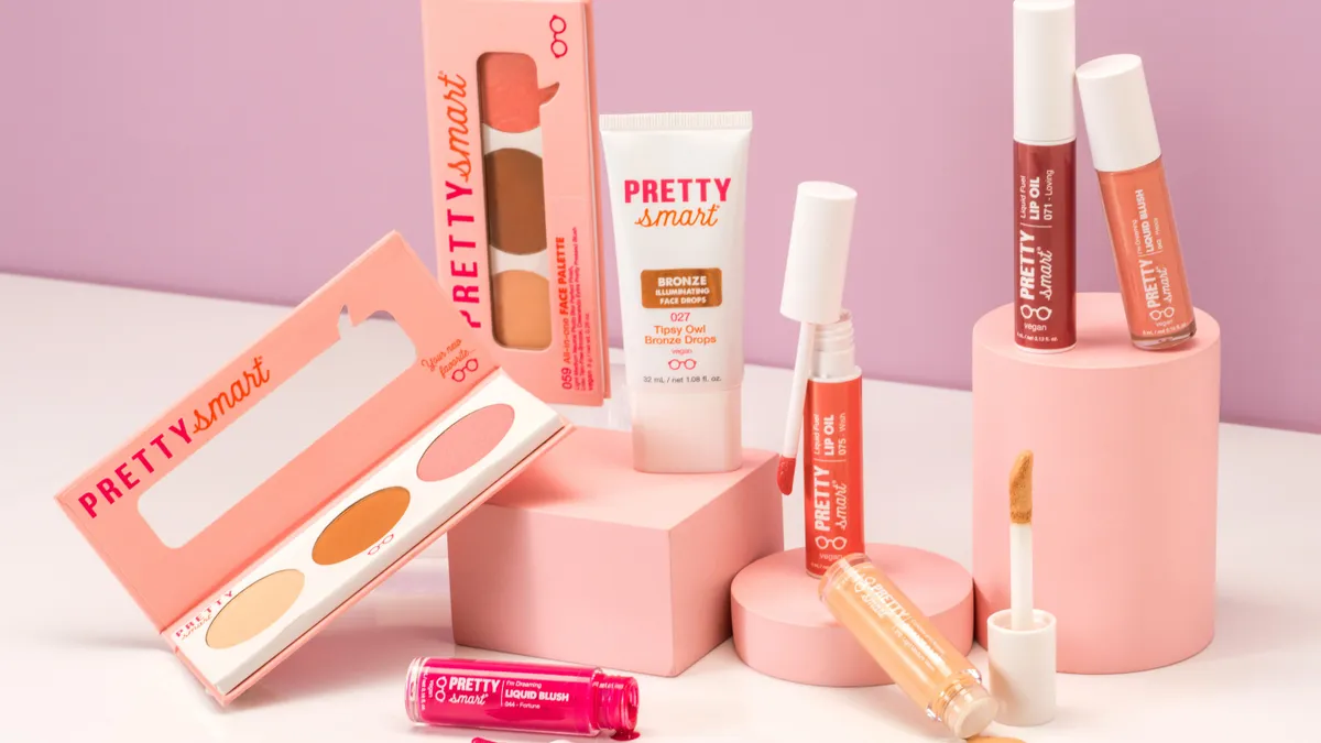 A display of makeup products with "Pretty Smart" branding on them.