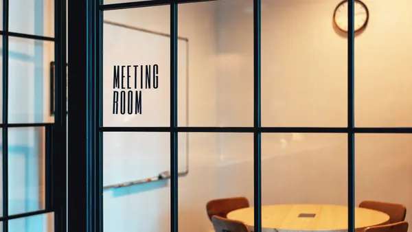 An empty meeting room with trendy black frames available for use