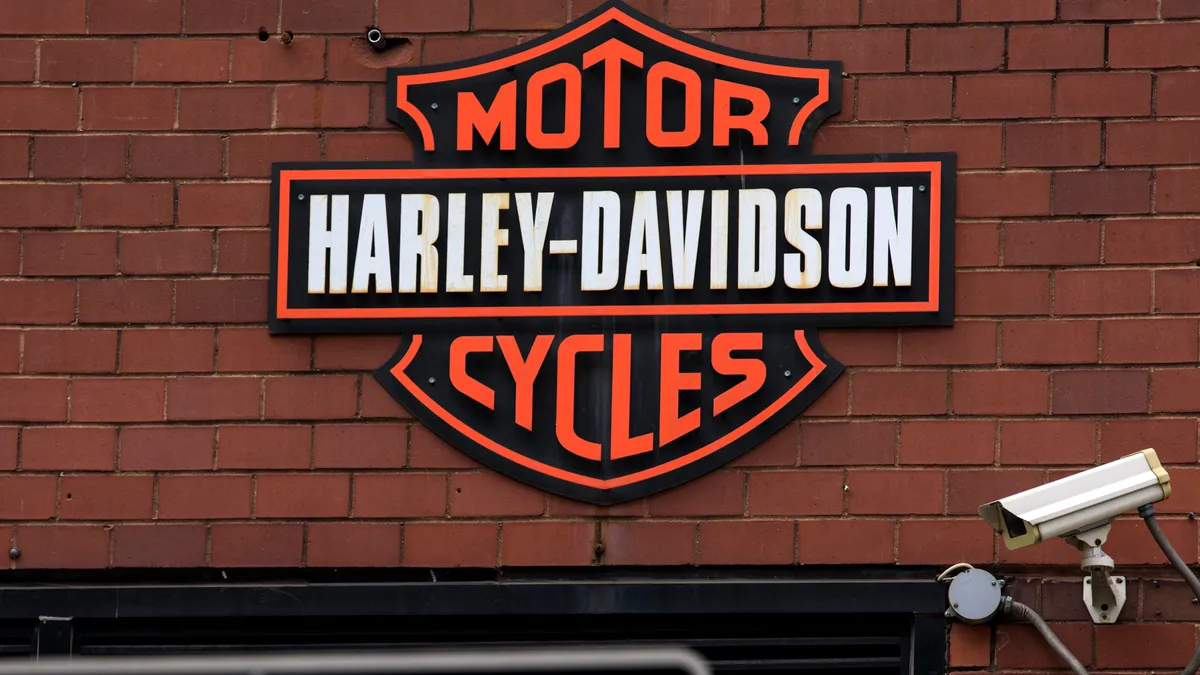 The Harley Davidson logo is displayed on the outside of a New York City store.