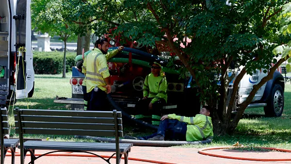 workers rest in the shade