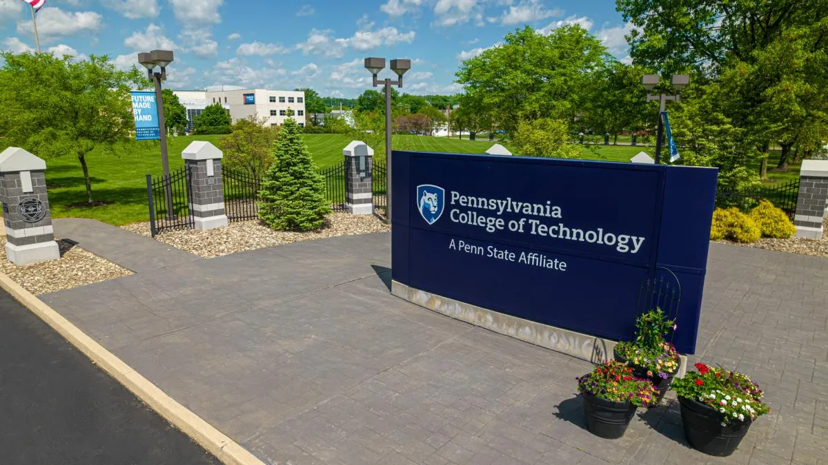 A sign labeled Pennsylvania College of Technology at one of the school's entrances.