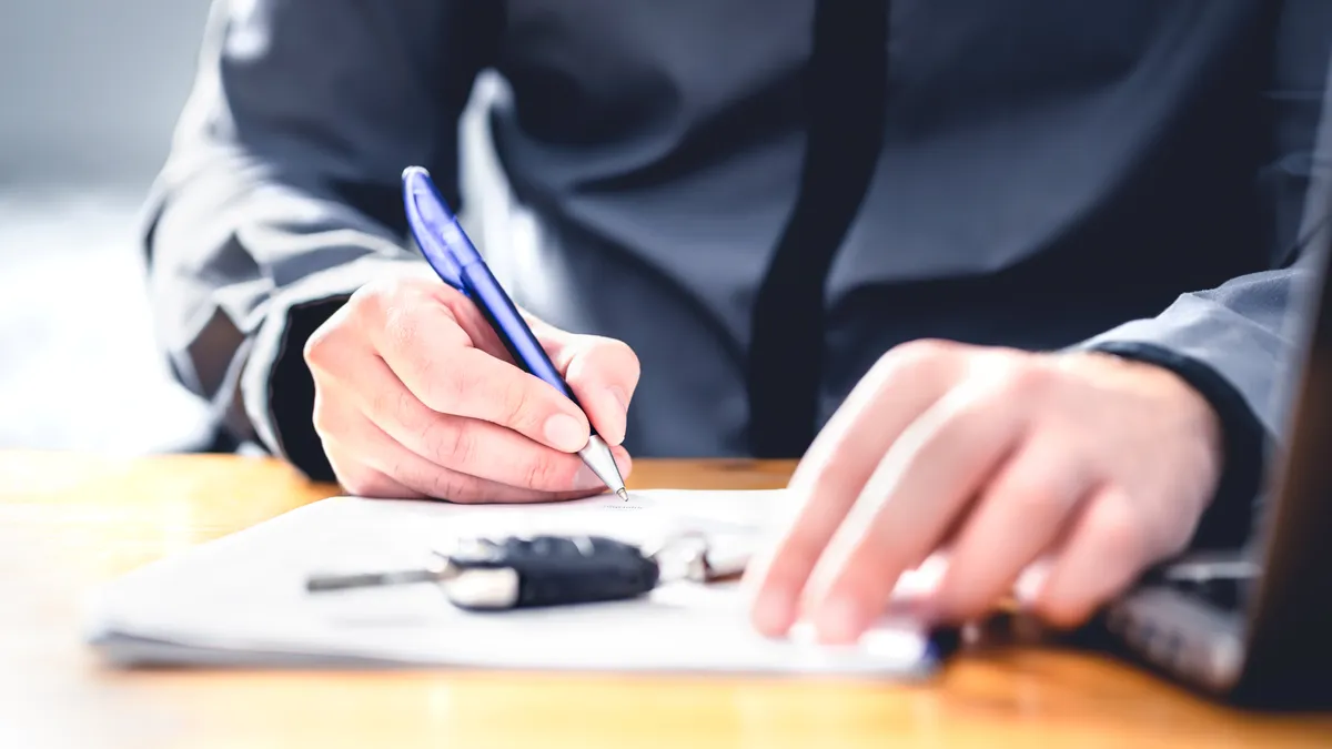 Businessman doing loan paperwork