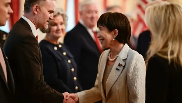 Man and woman shake hands