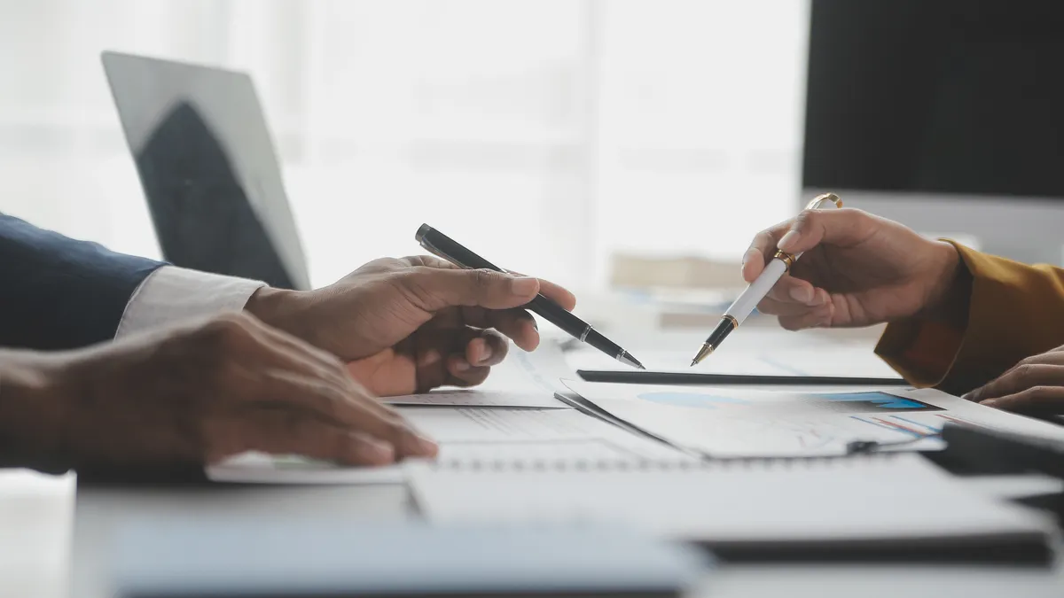 Financial analysts analyze business financial reports