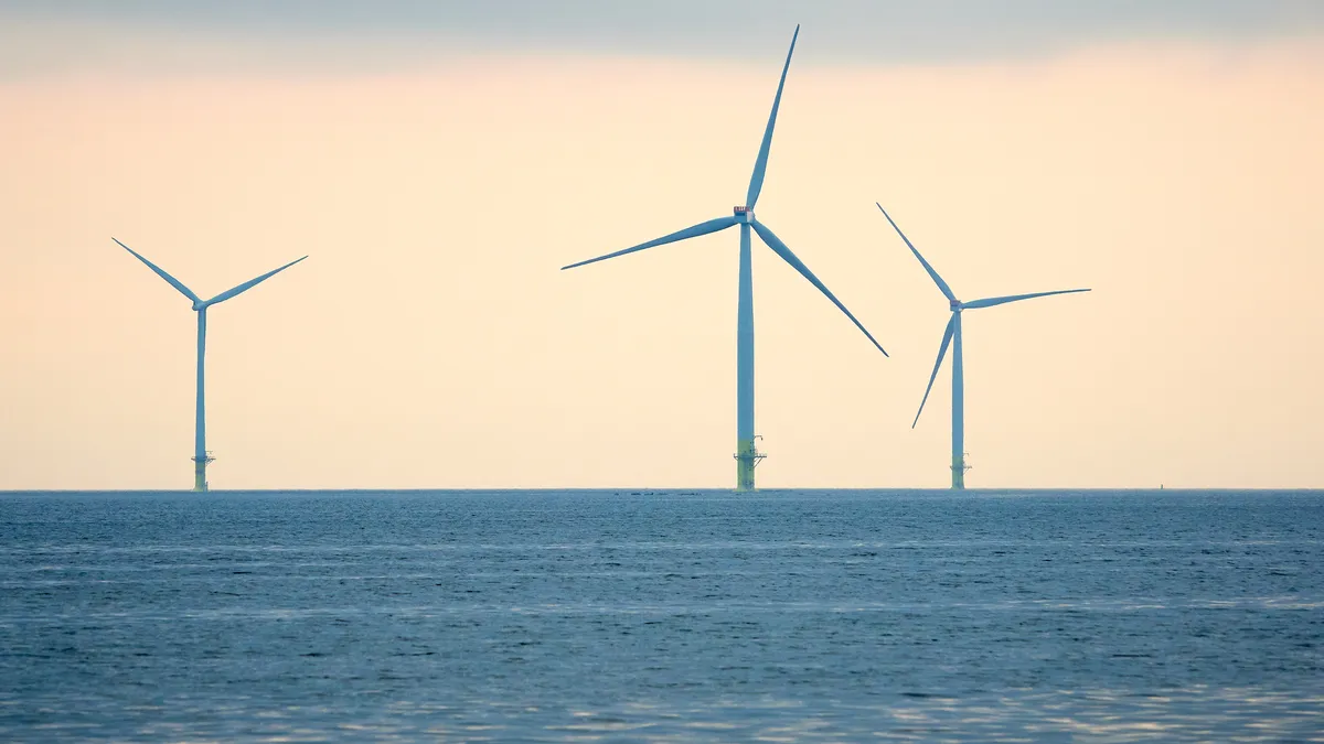 Offshore wind turbines in the ocean.