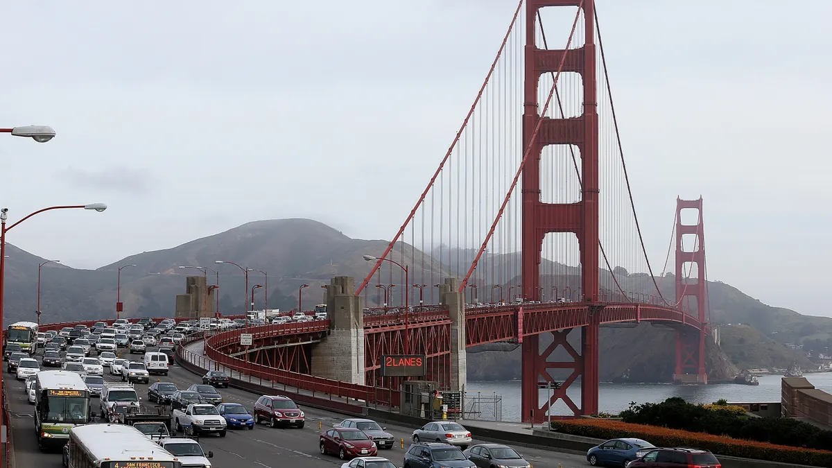 Vehicles driving over San Francisco's Golden Gate Bridge in California