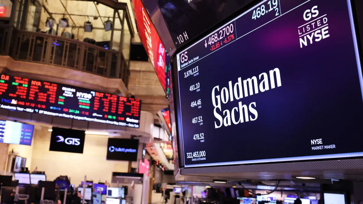 The Goldman Sachs company logo is displayed on a screen at the New York Stock Exchange during afternoon trading on August 02, 2024 in New York City.