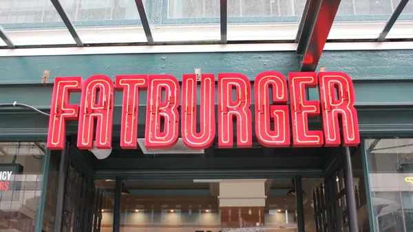 A close up image of a red sign that says Fatburger