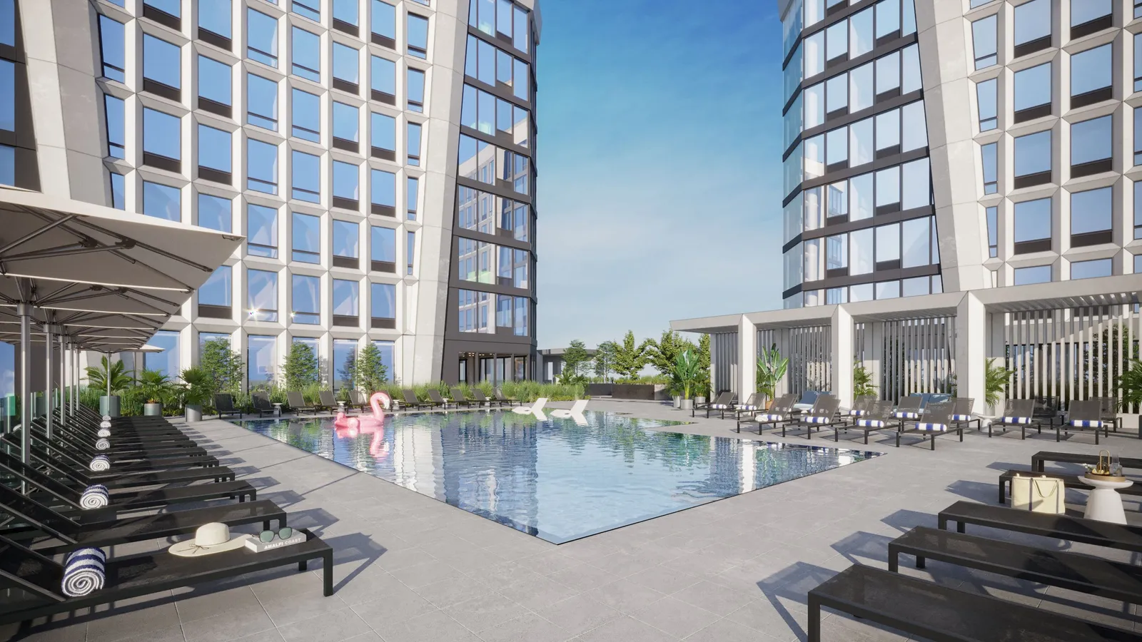 A rooftop pool at an apartment building, surrounded by lounge chairs.