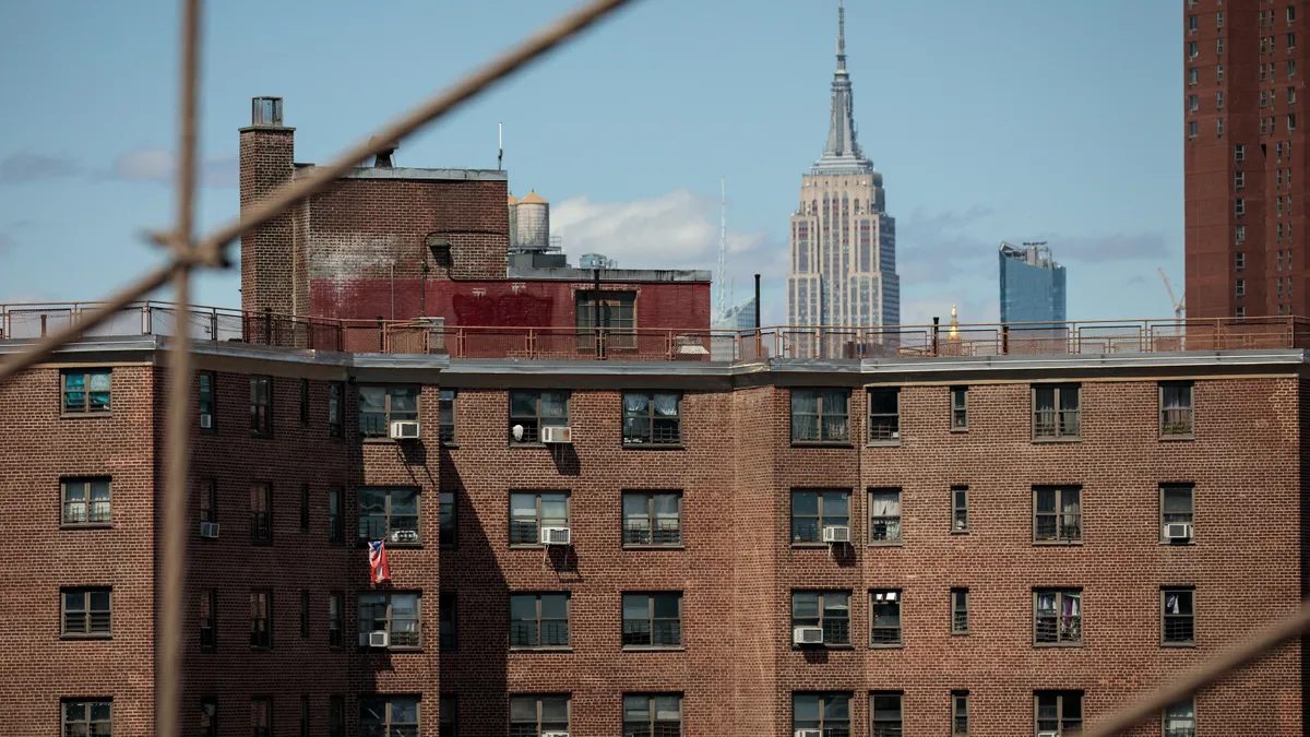 With the Empire State Building behind it, the Alfred E. Smith Houses, a public housing development built and maintained by the New York City Housing Authority (NYCHA), stand in in the Lower East Side