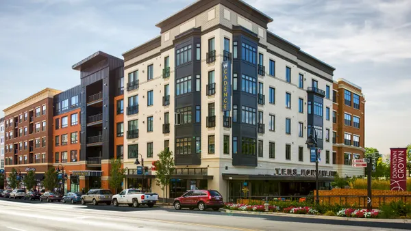Modern brick mid-rise apartment building.
