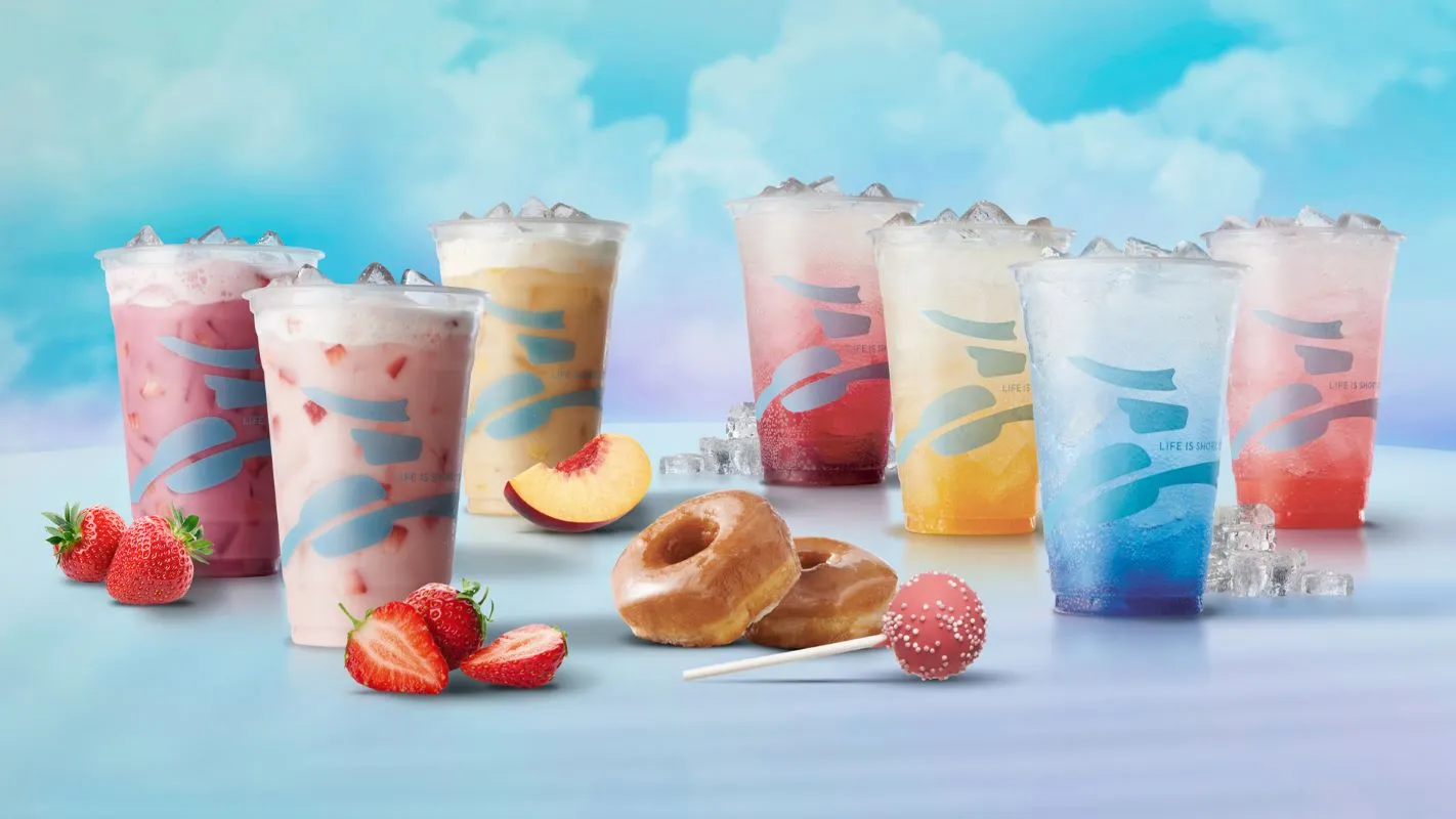 Seven different fruity drinks and donuts and a cake pop from Caribou Coffee