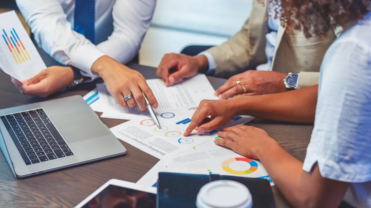 Employees doing market analysis