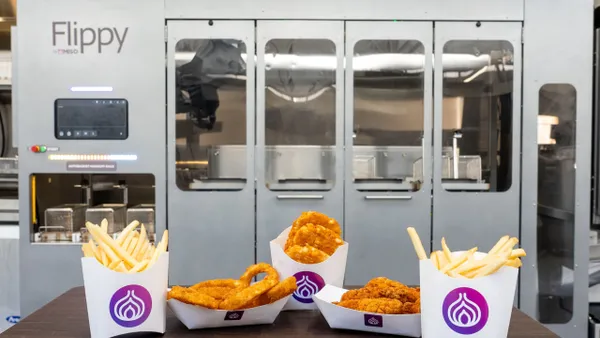 Fried foods in front of a Miso Robotics fry station.