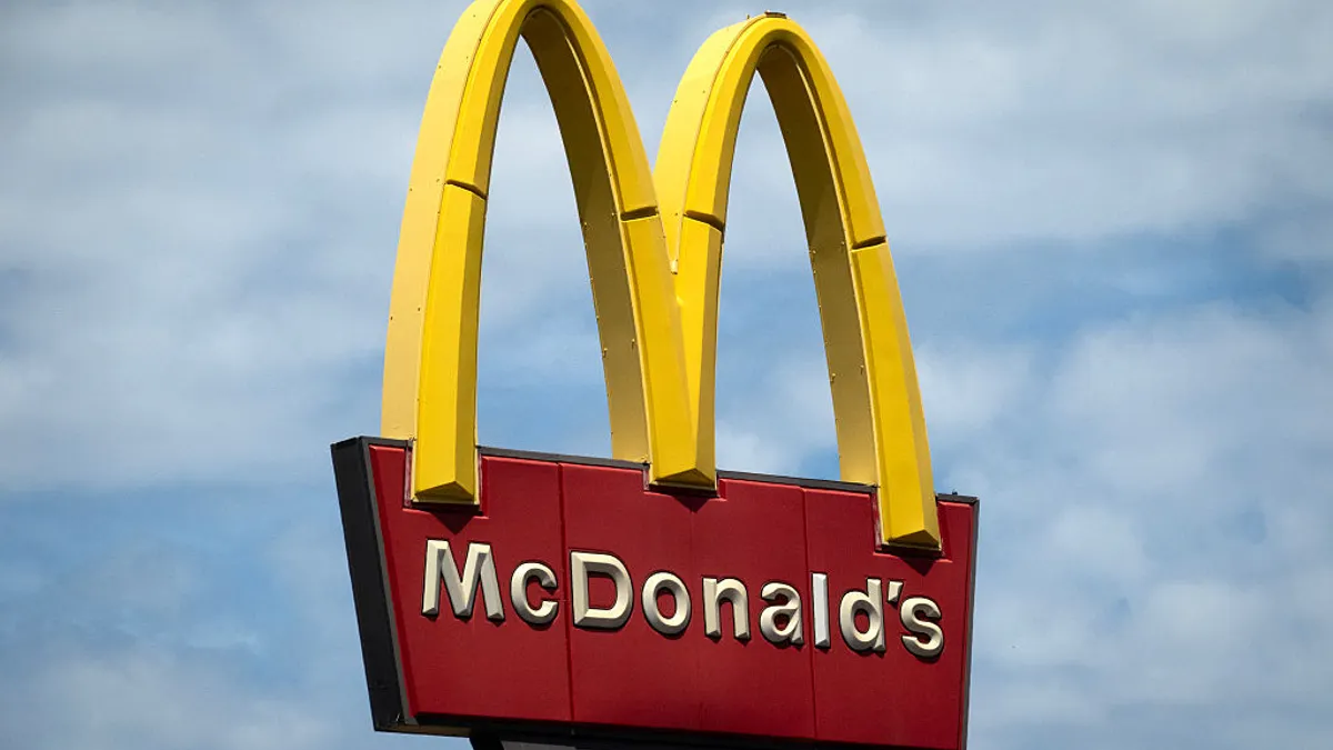 mcdonalds signage against a blue sky
