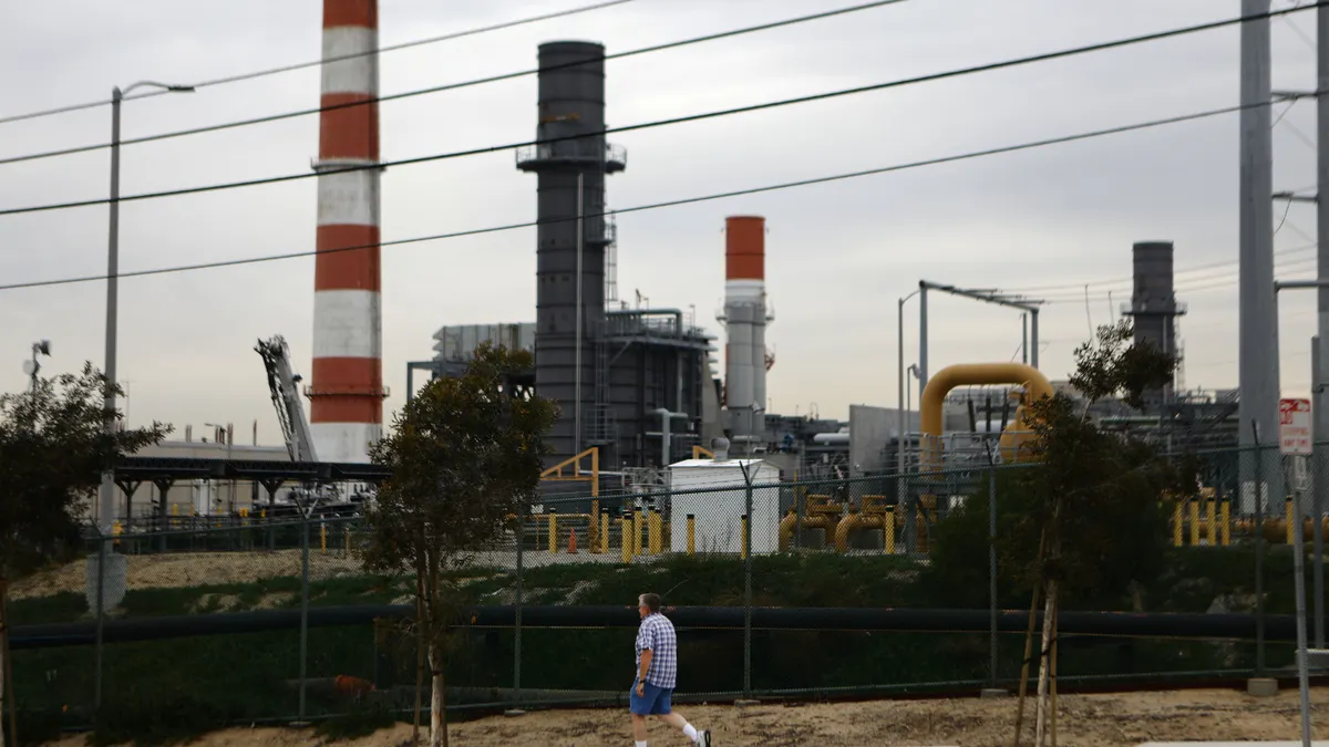 A man walks past the Scattergood Generating Station on February 12, 2019 in El Segundo, California.