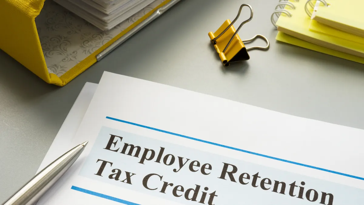 Employee retention tax credit papers and folder.