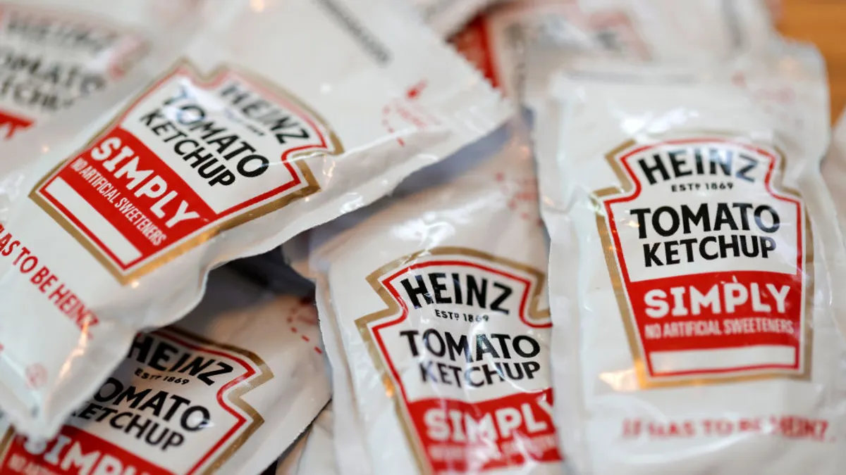 Packets of Heinz ketchup are displayed with Burger King french fries on April 12, 2021 in San Anselmo, California.