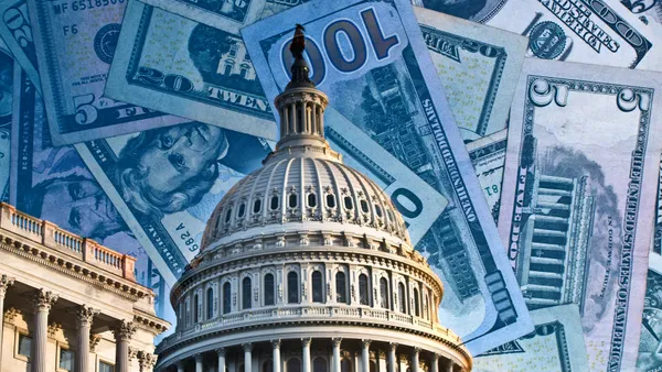 The U.S Capitol Rotunda is in front of a designed background of $100 bills.