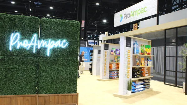 A ProAmpac conference booth with shelves displaying flexible packaging products.