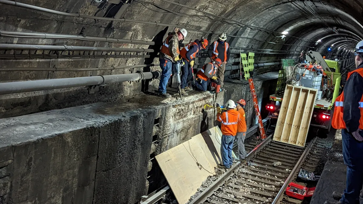 Workers repairing an Amtrak tunnel under the Hudson River.