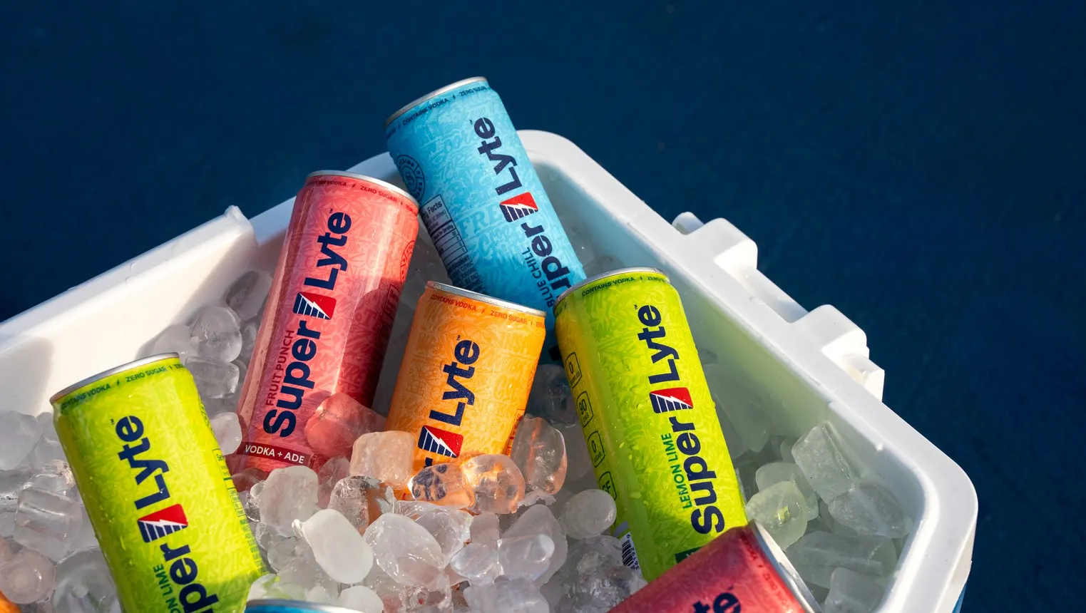 Cans of Super Lyte are in a cooler packed with ice.