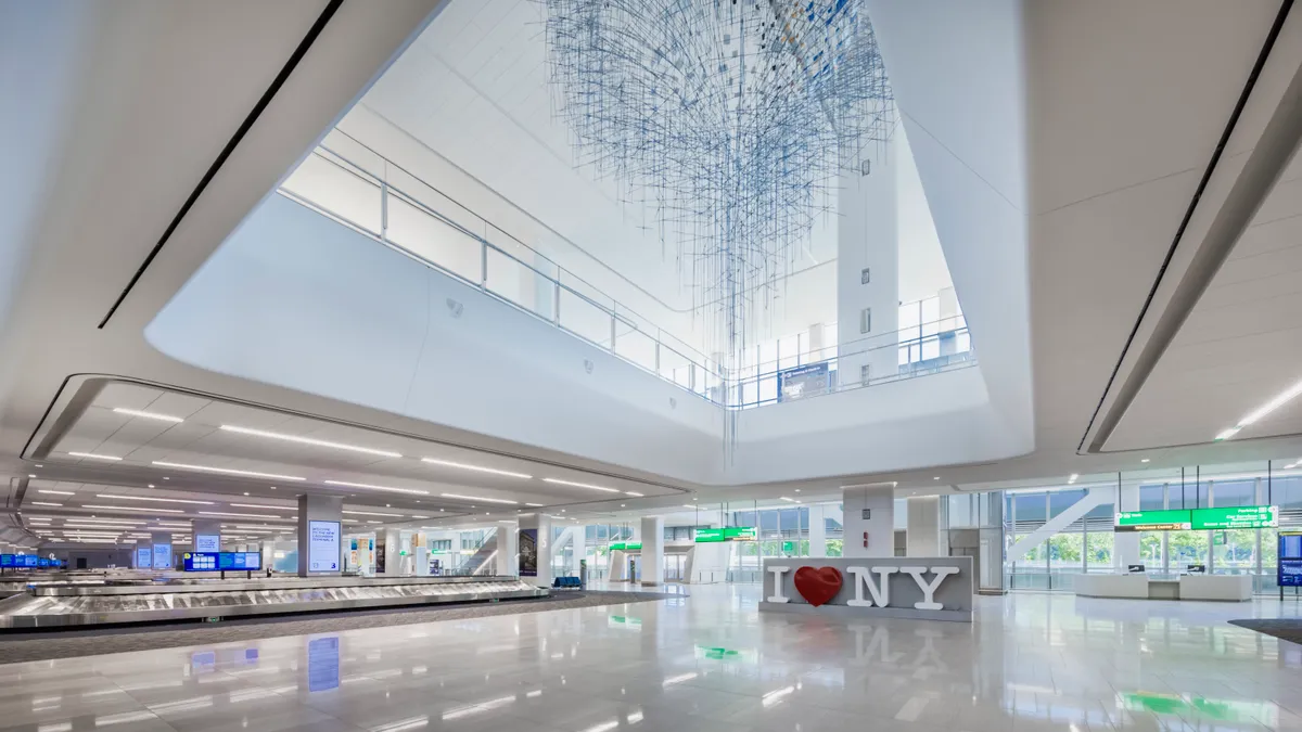 A view of the arrivals hall at LaGuardia where facility staff have full monitoring of the lighting controls as well as emergency lighting override from a centralized location.