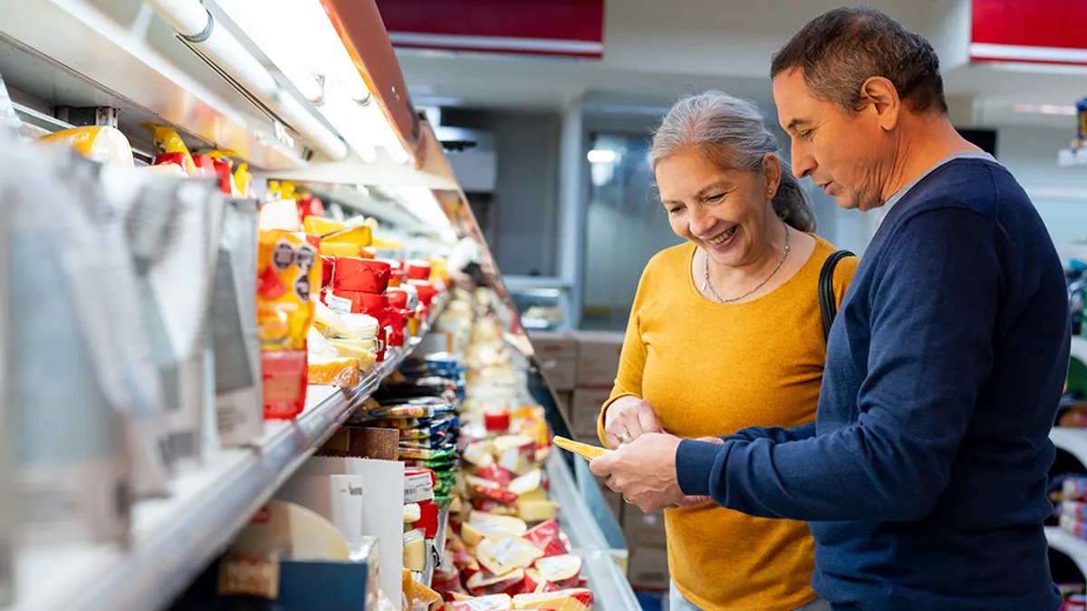 Shoppers reading packaging labels