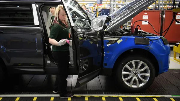 Doors are fitted and checked during production at the Jaguar Land Rover factory on March 1, 2017 in Solihull, England. Jaguar Land Rover is relaunching certain operations following a September 2025 cyberattack.