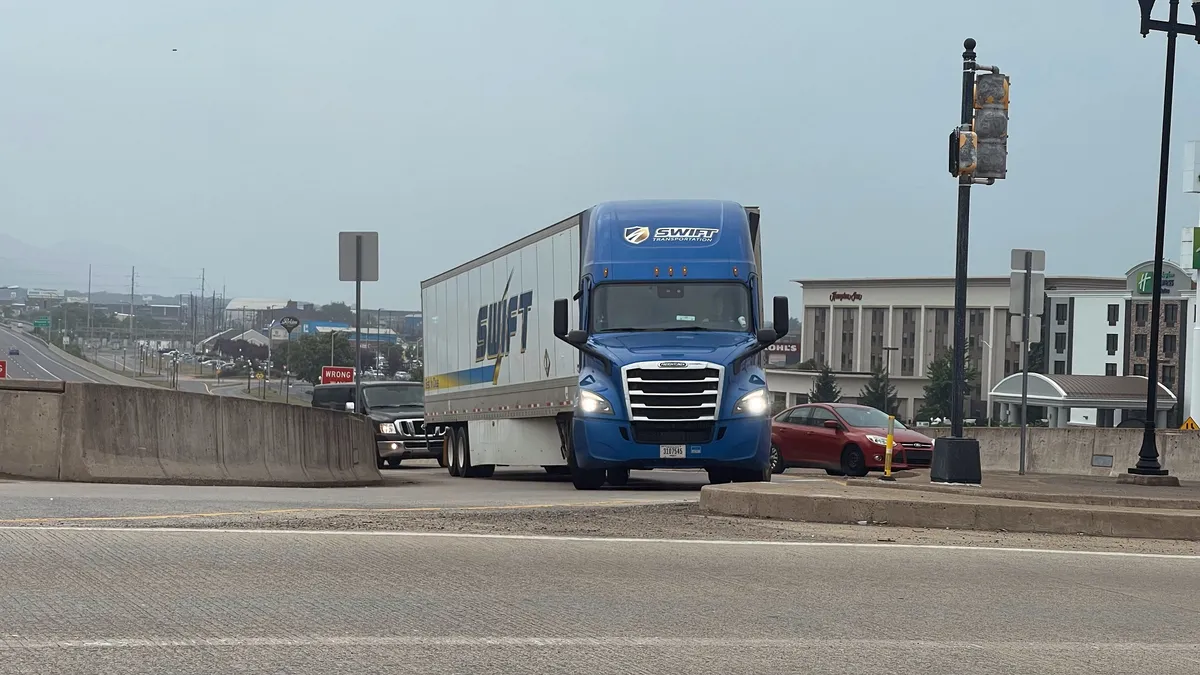 A Swift Transportation tractor-trailer exits Interstate 180 in Williamsport, Pennsylvania, on July 1, 2023.